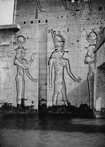 Assuan and Philae : reliefs of different deities on wing of 1st pylon. 